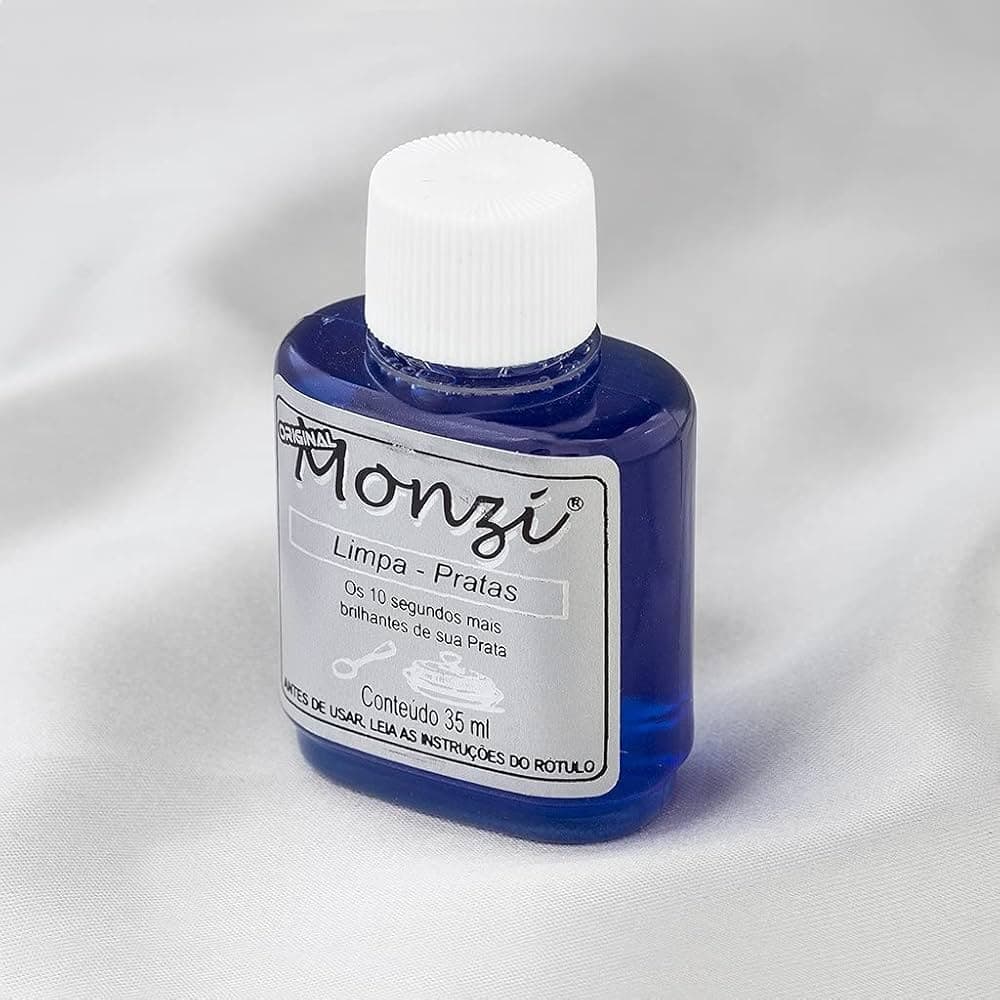 Frasco de 35 ml do Monzi Limpa Pratas, líquido azul com tampa branca